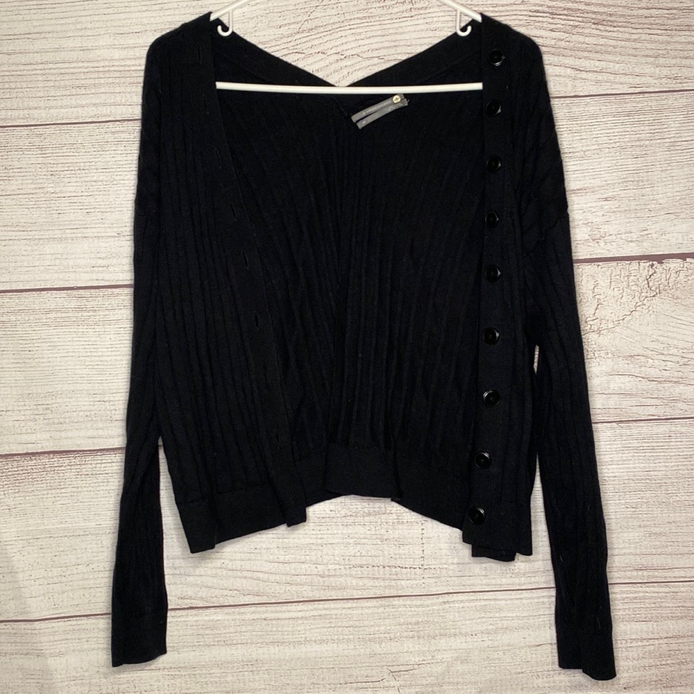 Anthropology Women’s black ribbed button up sweater. In excellent condition
